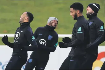  ?? Reuters ?? Raheem Sterling, second left, and Joe Gomez, second right, at England training yesterday