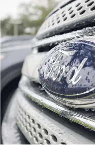  ?? AP ?? In this January 12, 2015 file photo, Ford vehicles sit on the lot at a car dealership, in Brandon, Florida. Ford Motor Company will export vehicles from China to the United States for the first time starting in 2019.