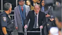  ??  ?? RICHARD DREW/ASSOCIATED PRESS
Harvey Weinstein leaves court in New York on Wednesday with two of his attorneys, Arthur Aidala and Donna Rotunno.