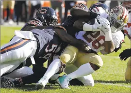  ?? NAM Y. HUH — ASSOCIATED PRESS ?? 49ers running back Carlos Hyde, getting tackled against the Bears, hasn’t visited the end zone in the past six games and doesn’t have a celebratio­n ready if he does score.