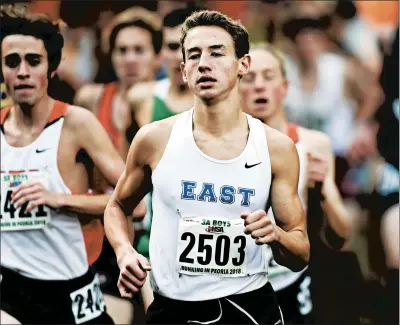  ?? ROB DICKER/NEWS-SUN ?? Lincoln-Way East’s Brett Gardner (2503) pushes himself forward in the Class 3A boys cross country state meet at Detweiller Park in Peoria on Saturday.