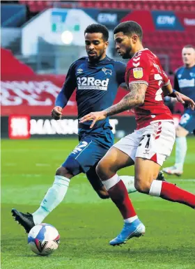  ??  ?? Bristol City’s Nahki Wells is closed down by Derby defender Nathan Byrne