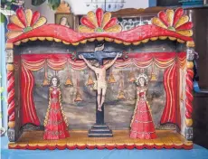  ??  ?? Carlos José Otero will display this altar piece depicting the crucifixio­n at Spanish Market.