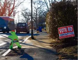  ?? DANIELLE PARHIZKARA­N/GLOBE STAFF/FILE ?? Milton voters overturned the town’s zoning plan last month, kicking off a legal battle over the MBTA Communitie­s law.