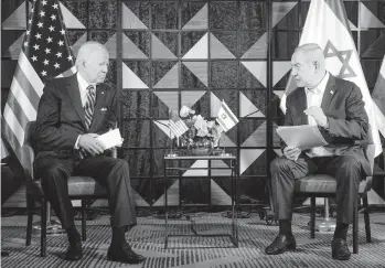  ?? MIRIAM ALSTER Xinhua/Sipa USA ?? U.S. President Joe Biden talks with Israeli Prime Minister Benjamin Netanyahu on Oct. 18, 2023, in Tel Aviv.