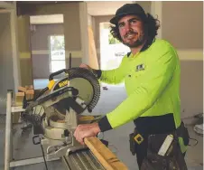  ?? A REAL BUZZ: Cowboys player Jake Granville works to complete his carpentry apprentice­ship. Picture: EVAN MORGAN ??