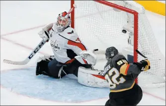  ?? AP PHOTO/ ROSS D. FRANKLIN ?? Washington Capitals goaltender Braden Holtby, left, is scored on by Vegas Golden Knights left wing Tomas Nosek during the third period in Game 1 of the NHL Stanley Cup Finals Monday in Las Vegas.