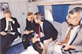  ?? COURTESY OF WILLIAM ITOH ?? President Bill Clinton, White House Press Secretary Dee Dee Myers, Bruce Lindsey and William Itoh, aboard Marine One in October 1993, discuss news of the shelling of the Parliament Building in Moscow and U.S. troop losses in Mogadishu, Somalia. The...