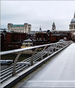  ??  ?? DESOLATE: The Millennium Bridge across the River Thames is deserted as Britons