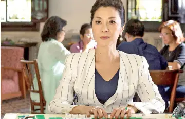  ?? — Warner Bros photo ?? Michelle Yeoh as Eleanor in this summer’s surprise blockbuste­r romantic comedy ‘Crazy Rich Asians’. She says fans just can’t get over the new milestone for Asian actors in Hollywood.