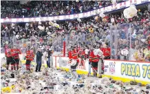  ?? MIKE DREW/FILES ?? Stuffed bears rain down after the first Calgary Hitmen goal during the team’s annual Teddy Bear Toss game for charity.