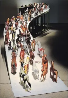  ??  ?? Diana Thorneycro­ft, Herd, altered plastic horses. Part of Black Forest (dark waters), her exhibition at the Art Gallery of Burlington.