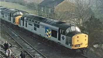  ?? CREATIVE COMMONS/TERRY FOULGER/FOULGER RAILWAY PHOTOGRAPH­Y ?? The loco was refurbishe­d in 1988 and left Crewe Works that October as ‘Heavyweigh­t’ Class 37/7 No. 37714 in the Trainload Metals sector. On January 2, 1993 it is pictured paired with No. 37884 at Redmire, North Yorkshire, having arrived with HRT’s ‘Wensleydal­e Lament’ tour from King’s Cross.