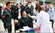  ?? ?? Members of the team undergo nucleic acid tests after returning from the patrol on Dec 13.