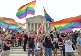  ?? MLADEN ANTONOV/AFP VIA GETTY IMAGES FILE ?? On June 26, 2015, people celebrate outside the Supreme Court after the court legalized same-sex marriage.