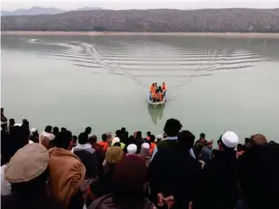  ?? (EPA) ?? A search operation is carried out for bodies after a boat capsized on Kohat dam