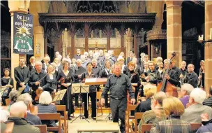  ??  ?? ●● Prestbury Choral Society’s last concert in April at St Bartholome­w’s in Wilmslow. Pictured: conductor, Simon Mercer, front, and left, wearing