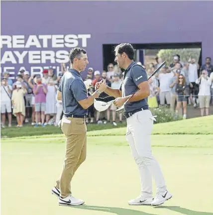  ?? ?? ↑ Rory Mcilroy and Adrian Otaegui shake hands after finishing their second round in the DP World Tour Championsh­ip