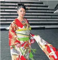  ?? ?? EXHIBITION: Model Sally Pritchett wearing an antique kimono, and a kimono owned by Freddie Mercury.