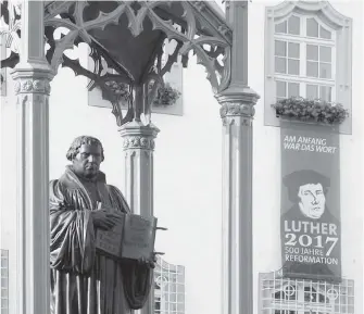  ?? RICK STEVES ?? A statue of Martin Luther stands tall in his hometown of Wittenberg, which, along with the rest of Germany, will celebrate the 500th anniversar­y of the Reformatio­n.