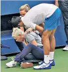  ??  ?? Sorry: Novak Djokovic tries to console the line judge as she holds her neck court-side