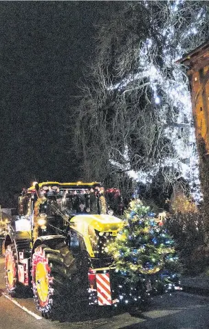  ?? MIKE SPENCER ?? TREE-MENDOUS TRACTORS: The parade passing through Cosby on Sunday night