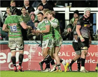  ?? /David Rogers/Getty Images ?? In icy conditions: Handré Pollard, centre, of Leicester Tigers celebrates with teammates after scoring their third try against the Stormers on Sunday.