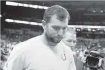  ?? MICHAEL CONROY/AP ?? Quarterbac­k Andrew Luck leaves the field following the Indianapol­is Colts’ loss to the Chicago Bears in a preseason game Saturday night. Fans booed Luck when word leaked out about his retirement at 29.