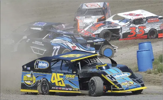  ??  ?? Mitch Stovka #45 exited Turn 3/4 ahead of a pile up of vehicles during the weekend opener for the Swift Current Stock Car Associatio­n.