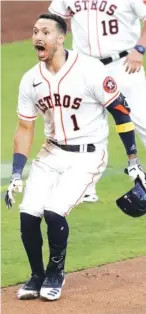  ?? AP PHOTO/ASHLEY LANDIS ?? The Houston Astros’ Carlos Correa reacts after his walkoff home run during the ninth inning in Game 5 of the AL Championsh­ip Series on Thursday in San Diego. The Astros defeated the Tampa Bay Rays 4-3.