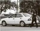  ?? Jon Shapley / Staff photograph­er ?? A reader questions whether letting criminals go would put the next officer in danger during a later traffic stop.