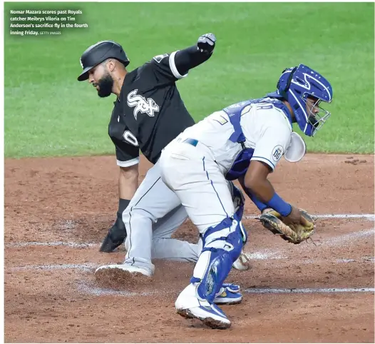  ?? GETTY IMAGES ?? Nomar Mazara scores past Royals catcher Meibrys Viloria on Tim Anderson’s sacrifice fly in the fourth inning Friday.