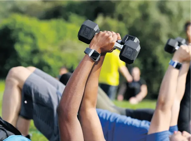  ?? DAVE KOTINSKY / GETTY IMAGES FOR FITBIT ?? People who use activity trackers purchase them as a way to encourage themselves to move more. But does that strategy really work?