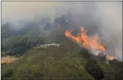  ?? DAVID ROYAL — THE MONTEREY COUNTY HERALD VIA AP ?? A wildfire burns in the Palo Colorado Canyon in the scenic Big Sur region of California’s Central Coast, Monday.