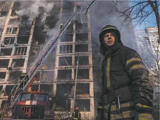  ?? Jonathan Pearlman is The Saturday Paper’s world editor and the editor of Australian Foreign Affairs. Chris Mcgrath / Getty Images ?? Firefighte­rs work to extinguish a smoulderin­g residentia­l apartment building in Kyiv after it was hit by a Russian attack this week.