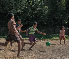  ?? WASHINGTON POST PHOTO BY ALLISON JOYCE ?? Jafar plays soccer in the Thaingkhal­i Rohingya refugee camp in Cox’s Bazar, Bangladesh.