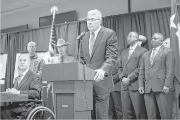  ?? Marie D. De Jesús / Houston Chronicle ?? Steve McCraw, right, director of the Texas Department of Public Safety, joined Gov. Greg Abbott for Monday’s announceme­nt of a new plan to curb gang violence, with Houston as the nerve center.