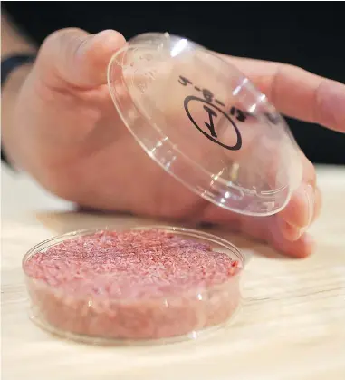  ?? DAVID PARRY VIA GETTY IMAGES ?? A burger made from cultured beef is shown at a press conference in 2013 in London. Makers of lab-grown meat are fighting with cattlemen’s groups, who take offence at the label “clean meat” for the artificial­ly grown product.