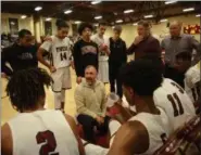  ?? TANIA BARRICKLO — DAILY FREEMAN ?? Kingston coach Ron Kelder instructs his players during a break in the action on Friday night.