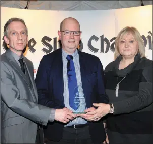  ??  ?? Michael McGetrick, receives the Volunteer of the Year award on behalf of his father, John, from Margaret Bolton, Sligo Champion and Victor Leonard, OSD.