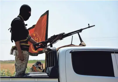  ?? YOUSSEF RABIE YOUSSEF, EUROPEAN PRESSPHOTO AGENCY ?? A Kurdish member of the Syrian Democratic Forces, part of the U.S.backed coalition, waits on a truck north of Raqqa as the final offensive on the Islamic State stronghold begins Tuesday.