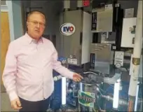  ?? DONNA ROVINS — DIGITAL FIRST MEDIA ?? The new Pottstown Express Laundry Center on Shoemaker Road in Pottstown features an advanced washing technology that injects Ozone into the water to clean and sanitize laundry without the need for bleach. Shown here is co-owner Charles Pasquale, with...