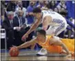  ?? JAMES CRISP - THE ASSOCIATED PRESS ?? Kentucky’s Reid Travis, top, and Tennessee’s Grant Williams chase down a loose ball during the first half of an NCAA college basketball game in Lexington, Ky., Saturday, Feb. 16, 2019.