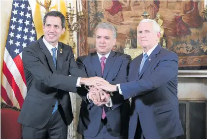  ?? Photo / AP ?? Leaders, including (from left) Juan Guaido, Ivan Duque and Mike Pence, met in Bogota to plan the next move in their campaign to replace Nicolas Maduro with Guaido.