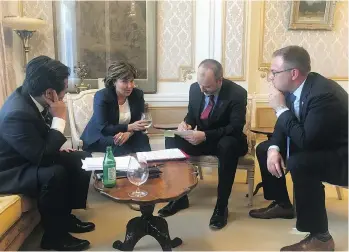  ?? STEPHEN SMART ?? Christy Clark chats with executive director of communicat­ions Ben Chin, left, chief of staff Mike McDonald, centre, and press secretary Stephen Smart in the French drawing room at Government House before the most important meeting of Clark’s political...