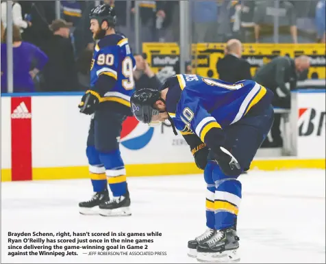  ?? — JEFF ROBERSON/THE ASSOCIATED PRESS ?? Brayden Schenn, right, hasn’t scored in six games while Ryan O’Reilly has scored just once in the nine games since delivering the game-winning goal in Game 2 against the Winnipeg Jets.