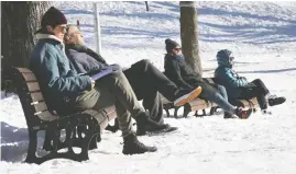  ?? CIRO DE LUCA / REUTERS; PIERRE OBENDRAUF / POSTMEDIA ?? With cold weather, Montrealer­s aren't likely to start throwing open windows
and balconies to sing together, the way Italians did in the spring of 2020.