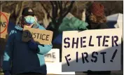  ??  ?? Nancy Park, left, and Angela Risdon gather by “the triangle” by Pine and Cypress streets on Saturday in Chico.