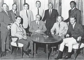  ?? DISPATCH FILE PHOTO ?? Rudy Hubbard, shown on Ohio State’s coaching staff in 1969, was hired as the first minority assistant coach at OSU by coach Woody Hayes, seated with glasses.