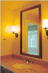  ??  ?? Sconces flanking your bathroom mirror will not only look great, they will make you look even better.